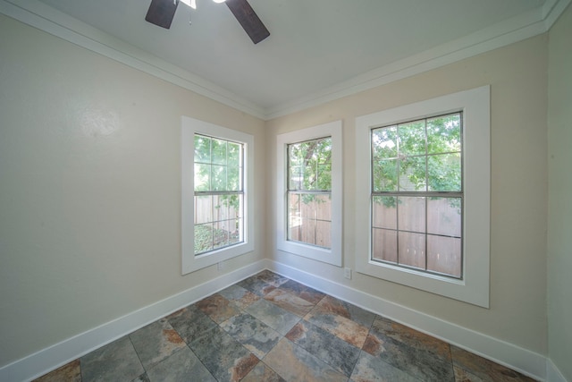1504 E Rosedale St, Fort Worth, TX 76104 - unfurnished room with stone tile floors, ornamental molding, healthy amount of natural light, and a ceiling fan