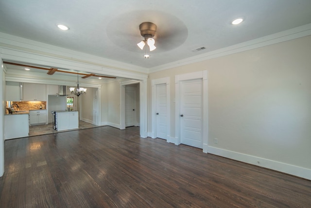 1504 E Rosedale St, Fort Worth, TX 76104 - unfurnished living room with ornamental molding, a chandelier, ceiling fan, dark wood-type flooring, and recessed lighting