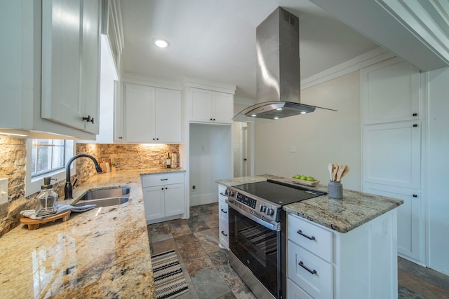 1504 E Rosedale St, Fort Worth, TX 76104 - kitchen with stainless steel range with electric cooktop, island range hood, backsplash, white cabinetry, and light stone counters