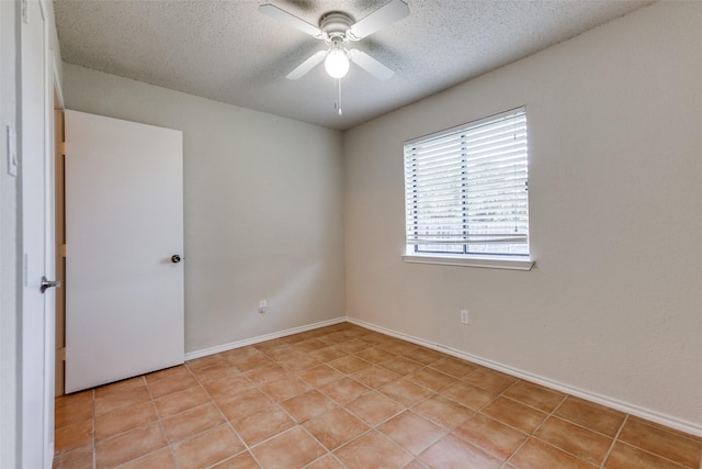 2314 Ember Lee Dr, Garland, TX 75040 - unfurnished room with a textured ceiling, ceiling fan, and light tile patterned floors