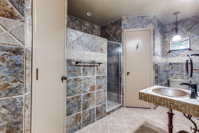 2314 Ember Lee Dr, Garland, TX 75040 - bathroom featuring a shower stall and tile walls