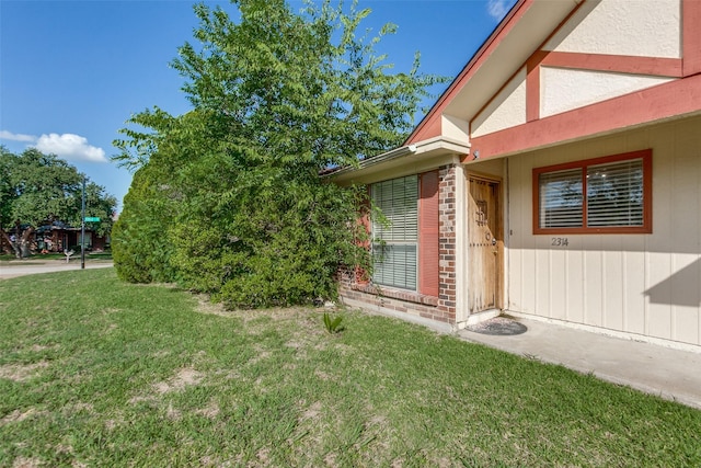 2314 Ember Lee Dr, Garland, TX 75040 - view of property exterior featuring a lawn