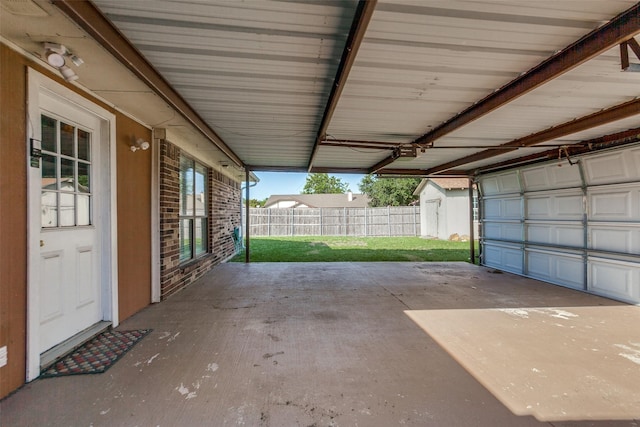2314 Ember Lee Dr, Garland, TX 75040 - garage featuring a storage shed
