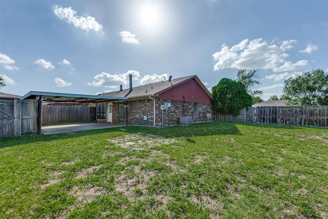 2314 Ember Lee Dr, Garland, TX 75040 - fenced backyard featuring a patio area and a carport