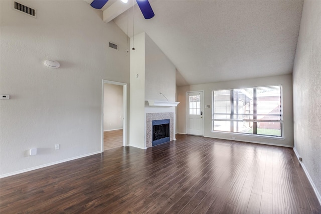 2314 Ember Lee Dr, Garland, TX 75040 - unfurnished living room with ceiling fan, high vaulted ceiling, dark wood-style flooring, beam ceiling, and a fireplace