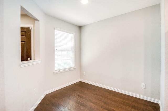 2111 Bentwater Ln, Frisco, TX 75036 - empty room with dark wood-style flooring and baseboards