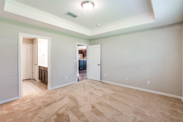 2111 Bentwater Ln, Frisco, TX 75036 - unfurnished bedroom featuring light carpet, ornamental molding, a raised ceiling, and ensuite bath