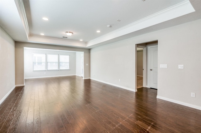 2111 Bentwater Ln, Frisco, TX 75036 - empty room featuring a tray ceiling, crown molding, dark wood-style floors, recessed lighting, and a smoke detector