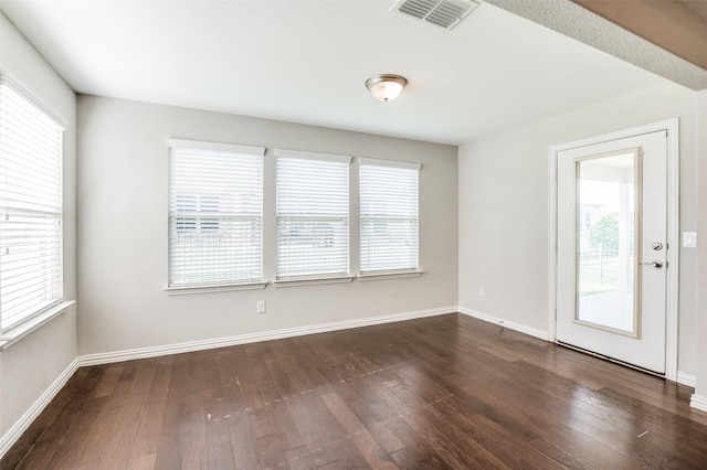 2111 Bentwater Ln, Frisco, TX 75036 - spare room with healthy amount of natural light and dark wood-style floors