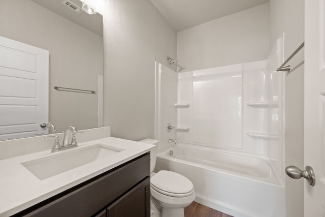 812 13th St, Plano, TX 75074 - bathroom featuring vanity, shower / bathtub combination, and wood finished floors