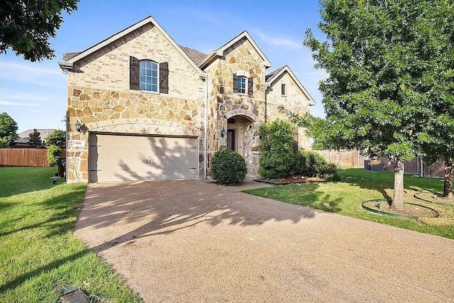 632 Fishback Cir, Plano, TX 75074 - french country home featuring stone siding, driveway, and an attached garage