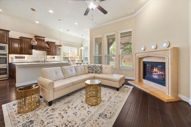 632 Fishback Cir, Plano, TX 75074 - living room with ceiling fan, a high end fireplace, ornamental molding, dark wood-style flooring, and recessed lighting