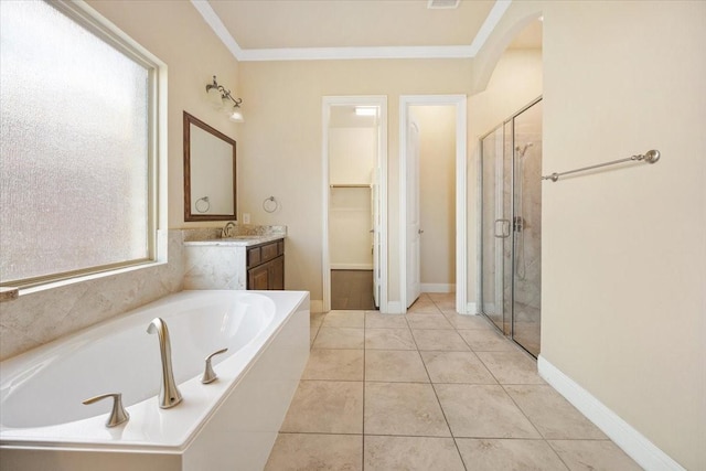 632 Fishback Cir, Plano, TX 75074 - bathroom featuring vanity, a garden tub, a stall shower, a walk in closet, and ornamental molding