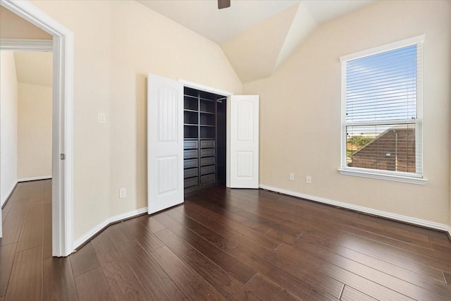632 Fishback Cir, Plano, TX 75074 - unfurnished bedroom with dark wood-type flooring, lofted ceiling, a closet, a walk in closet, and a ceiling fan