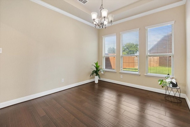 632 Fishback Cir, Plano, TX 75074 - empty room with a chandelier, a tray ceiling, dark wood finished floors, and crown molding