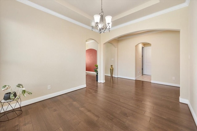 632 Fishback Cir, Plano, TX 75074 - empty room with arched walkways, a tray ceiling, a chandelier, wood finished floors, and ornamental molding