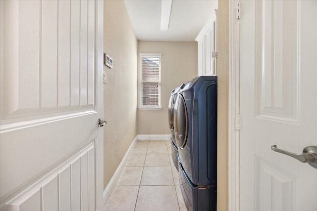 632 Fishback Cir, Plano, TX 75074 - washroom with separate washer and dryer, cabinet space, light tile patterned floors, and a textured wall