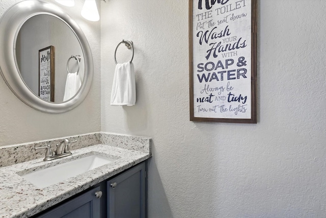 1227 Eaton Ln, Grapevine, TX 76051 - bathroom featuring vanity and a textured wall