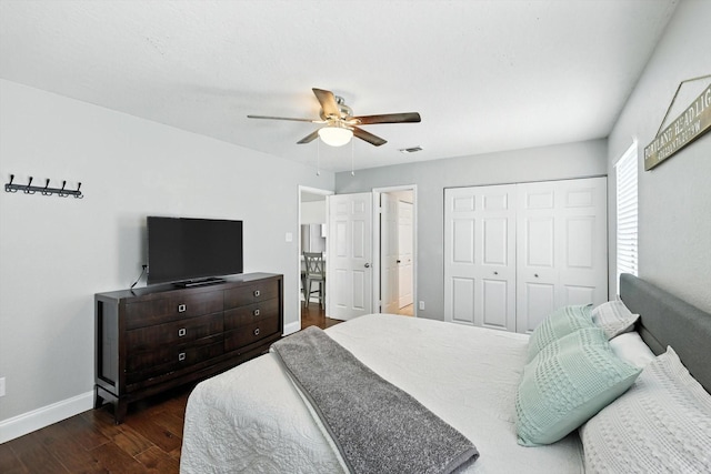 1227 Eaton Ln, Grapevine, TX 76051 - bedroom featuring dark wood finished floors, a closet, and a ceiling fan