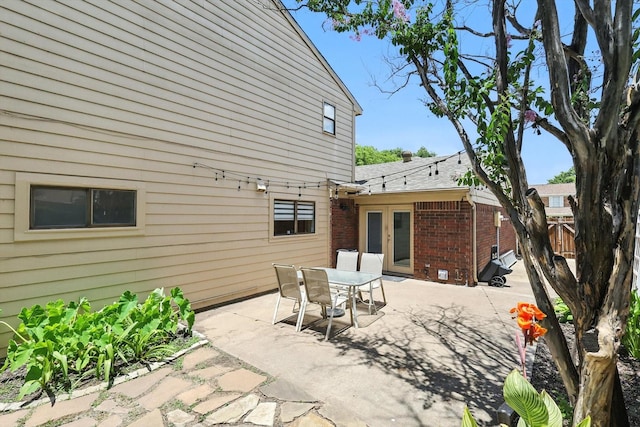 1227 Eaton Ln, Grapevine, TX 76051 - view of patio with outdoor dining space and french doors