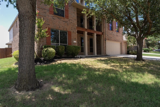 1220 Berkeley Dr, Burleson, TX 76028 - view of front facade featuring brick siding, concrete driveway, a garage, and a balcony