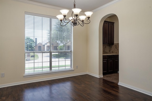 1220 Berkeley Dr, Burleson, TX 76028 - unfurnished dining area with a chandelier, ornamental molding, arched walkways, and dark wood-style flooring