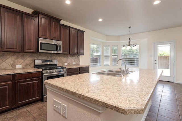1220 Berkeley Dr, Burleson, TX 76028 - kitchen featuring stainless steel appliances, recessed lighting, healthy amount of natural light, backsplash, and tile patterned floors