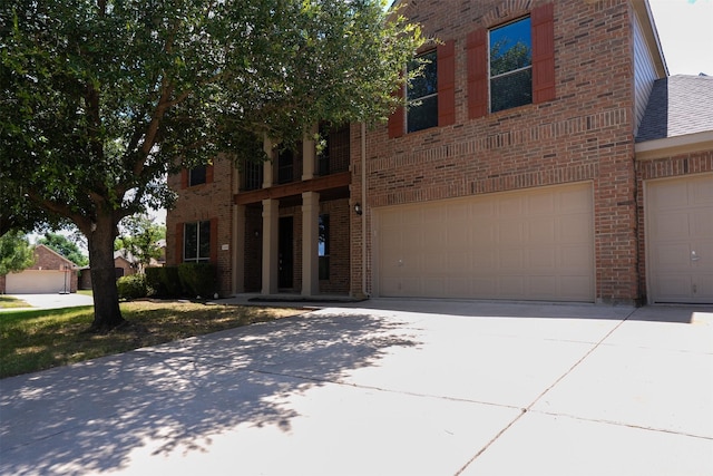1220 Berkeley Dr, Burleson, TX 76028 - view of front of property featuring brick siding, driveway, and an attached garage