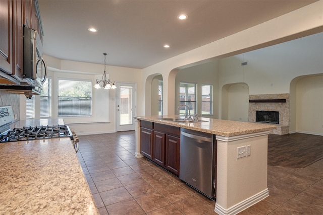 1220 Berkeley Dr, Burleson, TX 76028 - kitchen with stainless steel appliances, a chandelier, open floor plan, recessed lighting, and a kitchen island with sink