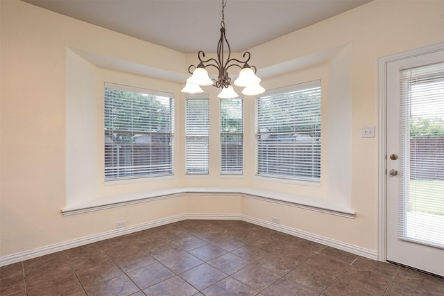 1220 Berkeley Dr, Burleson, TX 76028 - unfurnished dining area featuring a chandelier, plenty of natural light, and dark tile patterned flooring