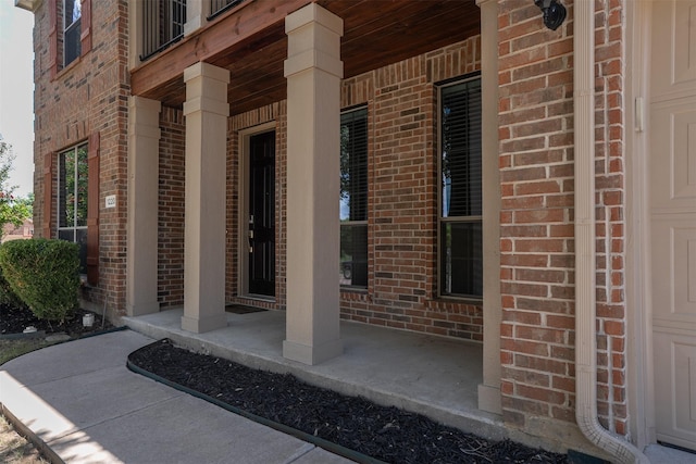1220 Berkeley Dr, Burleson, TX 76028 - property entrance with brick siding and a porch