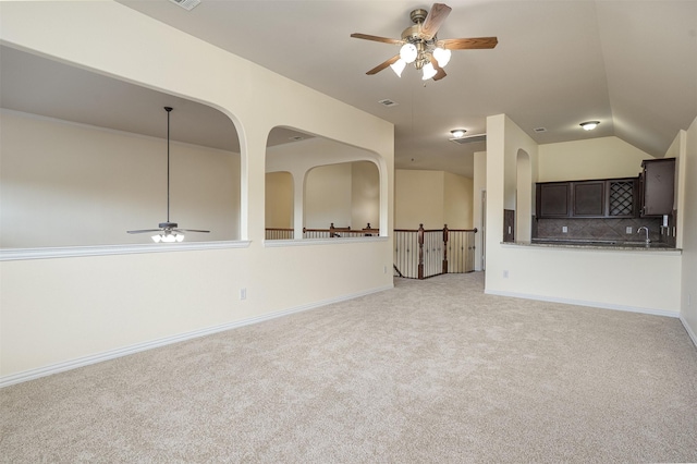 1220 Berkeley Dr, Burleson, TX 76028 - unfurnished living room featuring ceiling fan, light colored carpet, and vaulted ceiling