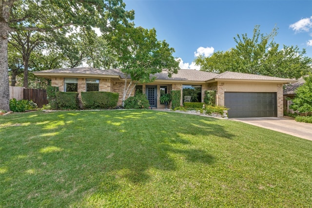 5205 Shady Springs Ct, Arlington, TX 76017 - single story home featuring an attached garage, concrete driveway, and brick siding