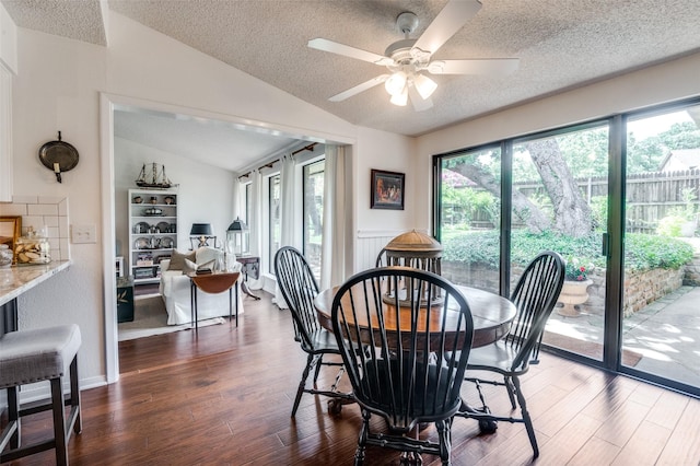 5205 Shady Springs Ct, Arlington, TX 76017 - dining area with lofted ceiling, a textured ceiling, healthy amount of natural light, dark wood-type flooring, and a ceiling fan