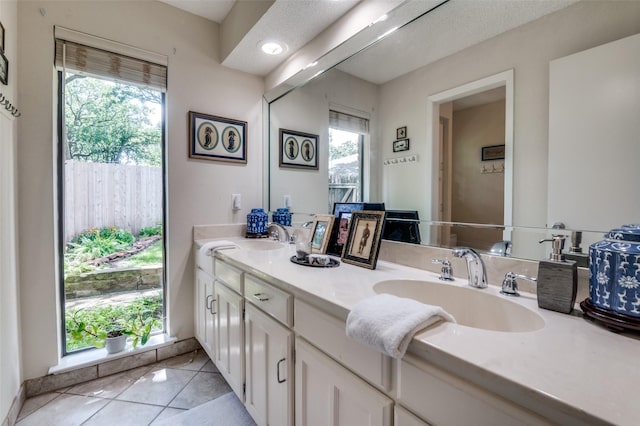 5205 Shady Springs Ct, Arlington, TX 76017 - full bathroom with double vanity, tile patterned flooring, and healthy amount of natural light