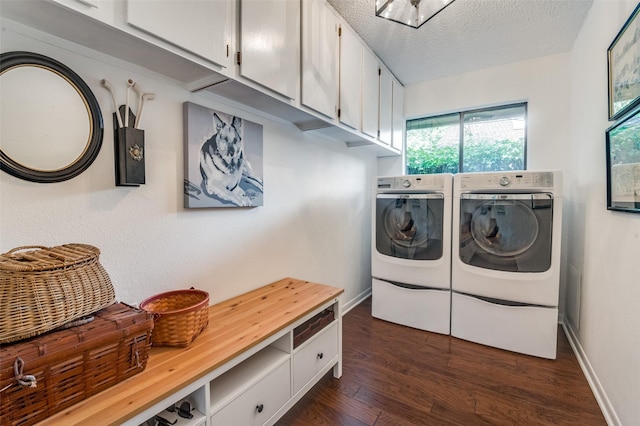 5205 Shady Springs Ct, Arlington, TX 76017 - laundry room featuring washer and clothes dryer, dark wood-style flooring, cabinet space, and a textured ceiling