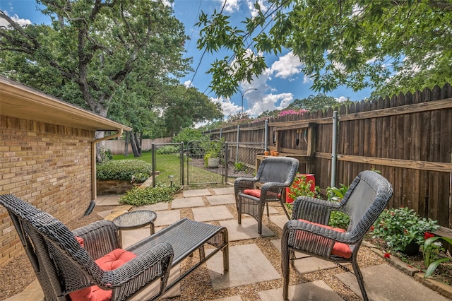 5205 Shady Springs Ct, Arlington, TX 76017 - fenced backyard with a patio and a gate
