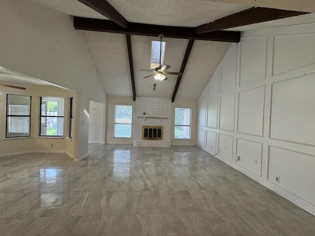 510 Betsy Ross Dr, Arlington, TX 76002 - unfurnished living room with ceiling fan, beam ceiling, light marble finish flooring, a decorative wall, and high vaulted ceiling