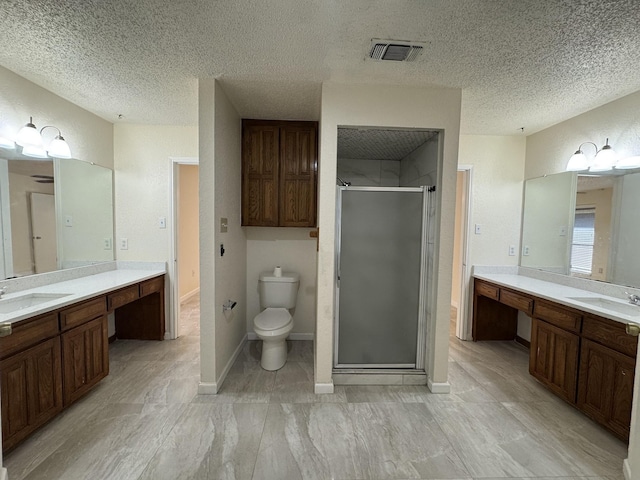 510 Betsy Ross Dr, Arlington, TX 76002 - full bathroom featuring a stall shower, two vanities, and a textured ceiling