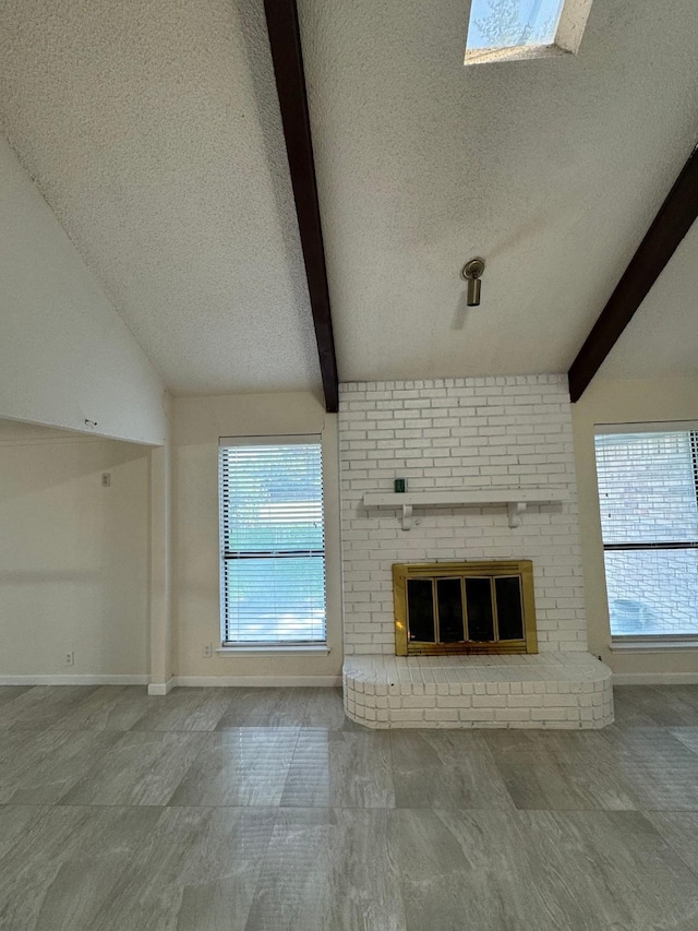510 Betsy Ross Dr, Arlington, TX 76002 - unfurnished living room with a textured ceiling, healthy amount of natural light, and a fireplace