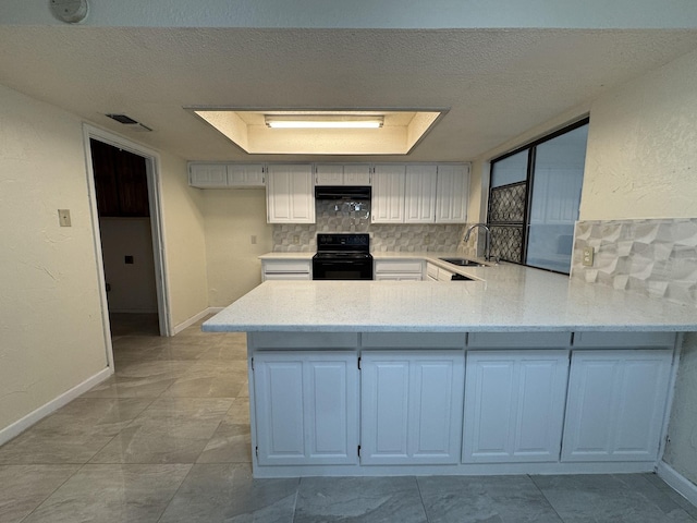 510 Betsy Ross Dr, Arlington, TX 76002 - kitchen with black / electric stove, backsplash, a peninsula, a textured ceiling, and range hood