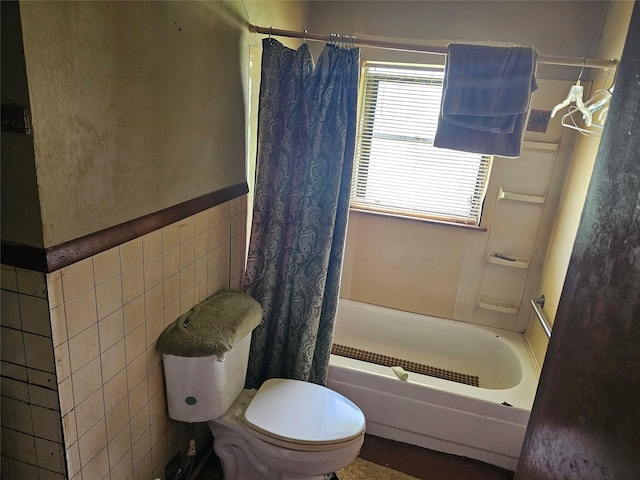 1120 H Ave, Plano, TX 75074 - full bathroom featuring tile walls, shower / bath combo with shower curtain, and wainscoting