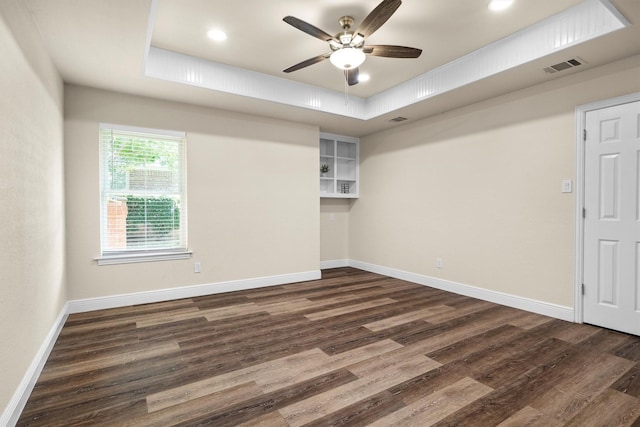 334 Pebblebrook Dr, Grapevine, TX 76051 - unfurnished room with dark wood-type flooring, ceiling fan, a tray ceiling, and recessed lighting