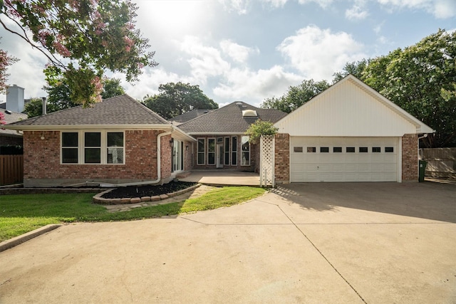 334 Pebblebrook Dr, Grapevine, TX 76051 - single story home with concrete driveway, a garage, brick siding, and a shingled roof