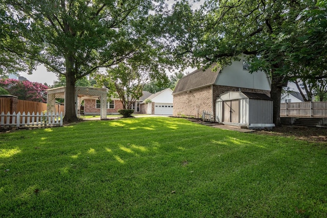 334 Pebblebrook Dr, Grapevine, TX 76051 - view of yard with a storage shed and a garage