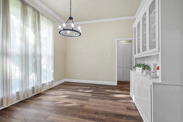 334 Pebblebrook Dr, Grapevine, TX 76051 - unfurnished dining area with a chandelier, crown molding, and dark wood-style floors