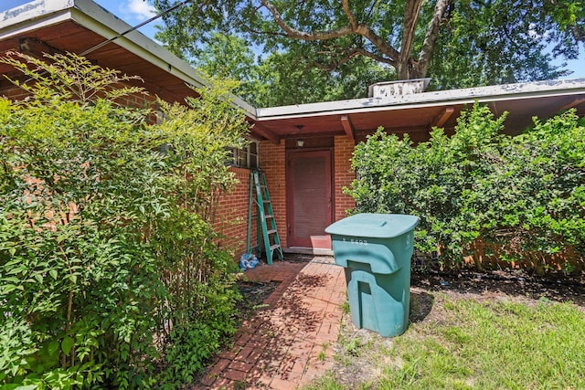 216 W Dexter St, Sherman, TX 75092 - property entrance featuring brick siding
