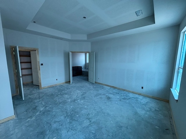 2017 Kelva Dr, Haslet, TX 76052 - spare room featuring a raised ceiling, concrete floors, and healthy amount of natural light