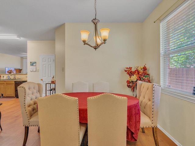 1928 Juniper Dr, Little Elm, TX 75068 - dining area featuring a chandelier and light wood finished floors