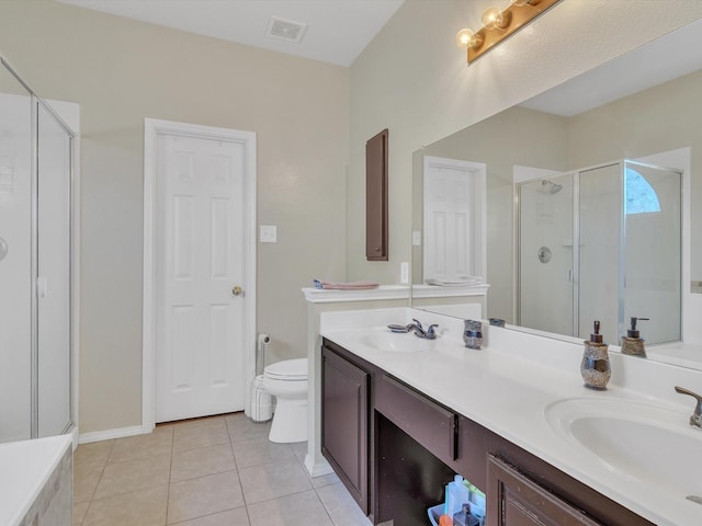 1928 Juniper Dr, Little Elm, TX 75068 - bathroom with a shower stall, double vanity, and tile patterned flooring